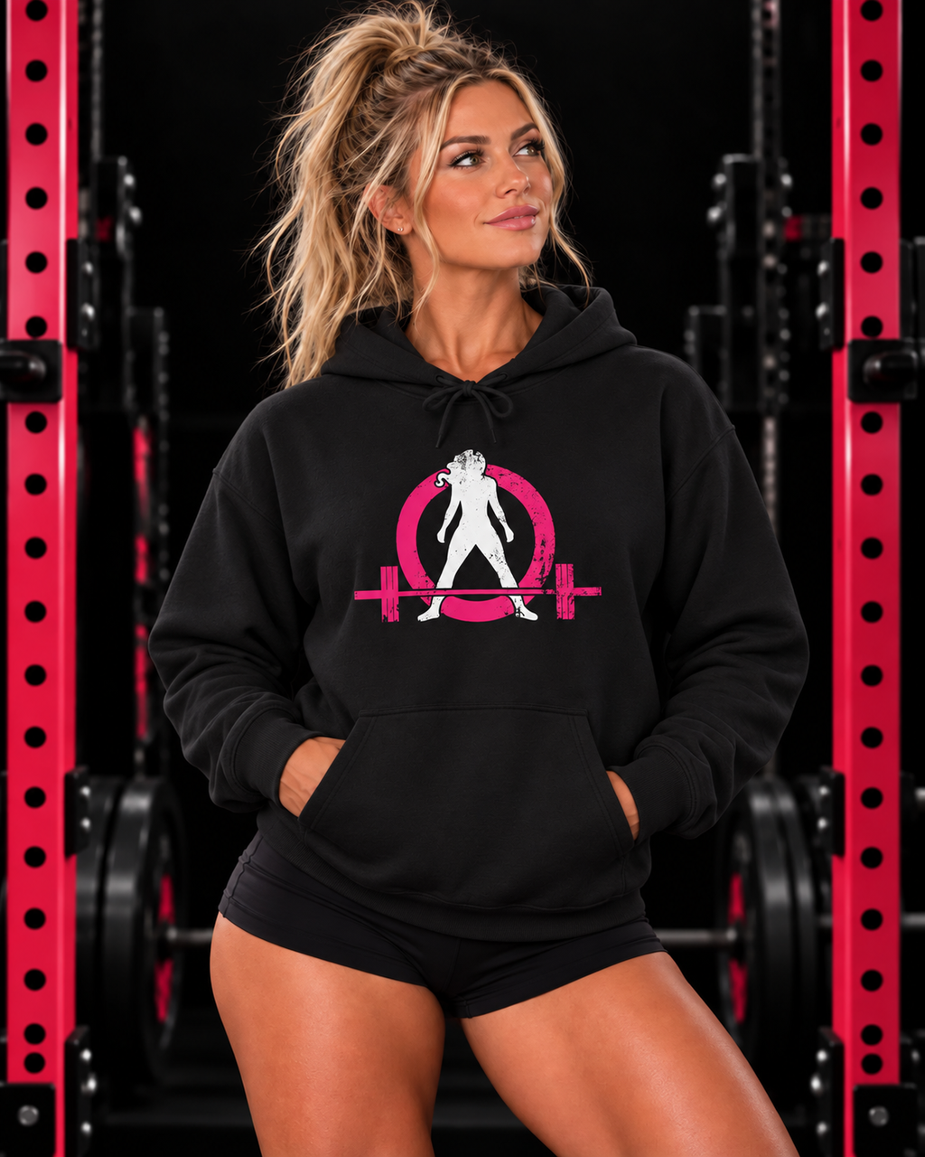 WWLW black hoodie with pink and white distressed logo, modeled in a pink and black gym
