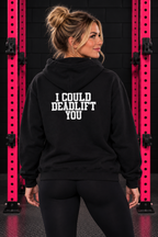 Back view of woman wearing black WWLW hoodie with white I Could Deadlift You print in black and pink gym