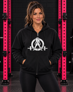Woman wearing black Women Who Lift Weights full-zip hoodie with distressed white logo in black and pink gym