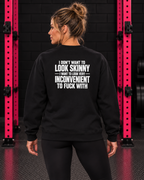 Black sweatshirt with white slogan back print, modeled in the WWLW black brick and hot-pink rack gym.