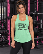 Woman wearing mint Lift Weights and Hang Out With My Dog racerback tank in a dark gym