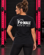 Maid of Iron women's black Softstyle tee, white back print in the WWLW gym