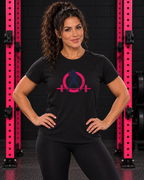 Woman wearing black WWLW women's distressed color logo tee in black and pink gym